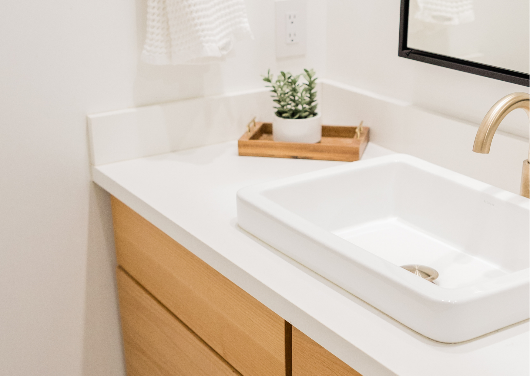 White vanity unit and bathroom fittings